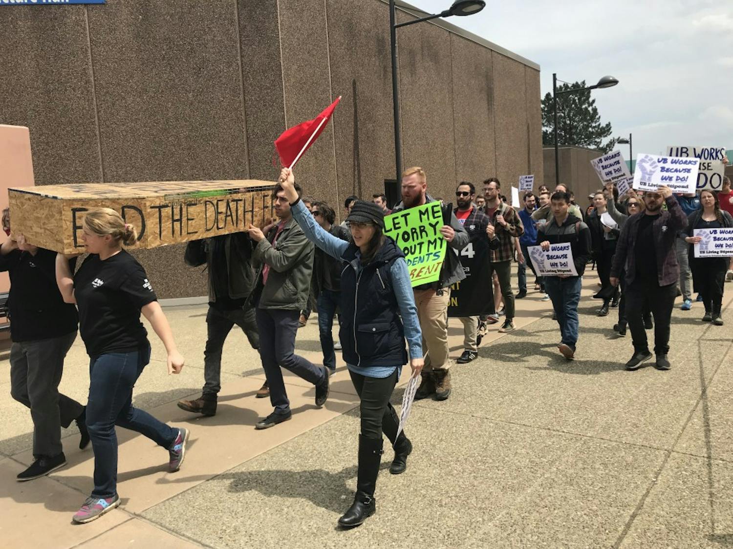 &nbsp;Protesters march from Clemens Hall to Capen Hall carrying a coffin made of plywood.&nbsp;