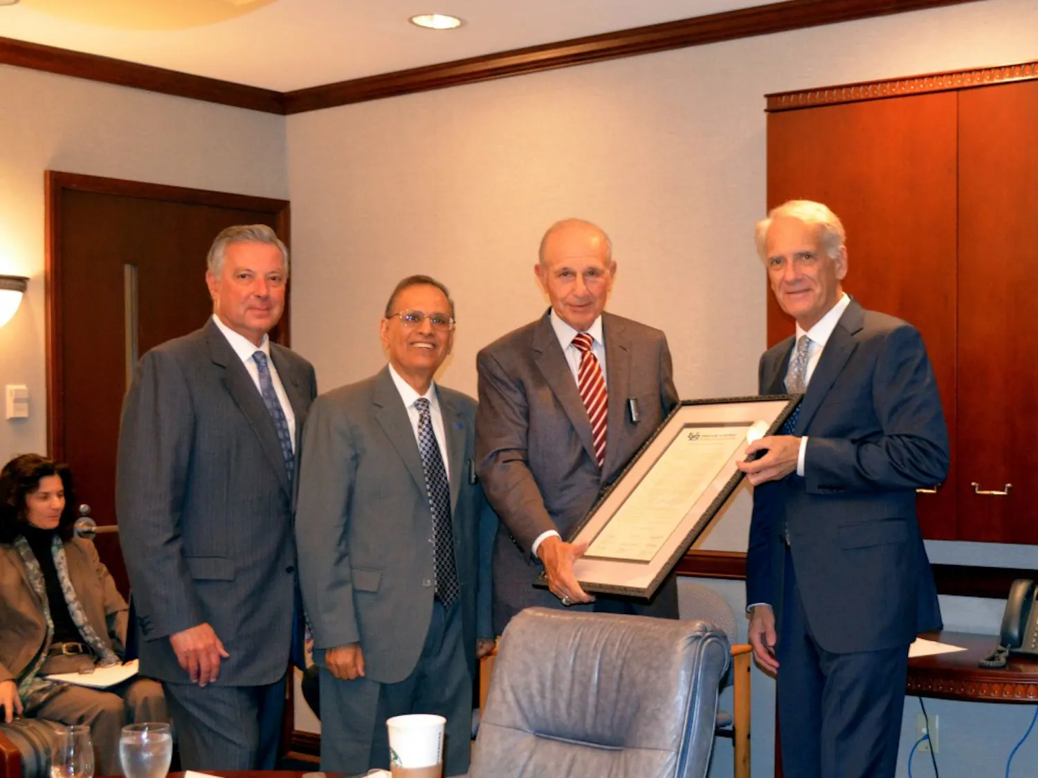 (From L to R) Michael E. Cain, dean of the medical school, President Satish Tripathi, UB Council Chairman Jeremy Jacobs and Vice Chairman of UB Council Mark J. Czarnecki at Wednesday's UB Council meeting. The Council discussed the "White Only" art project, arrests in the Heights and the new downtown medical campus.