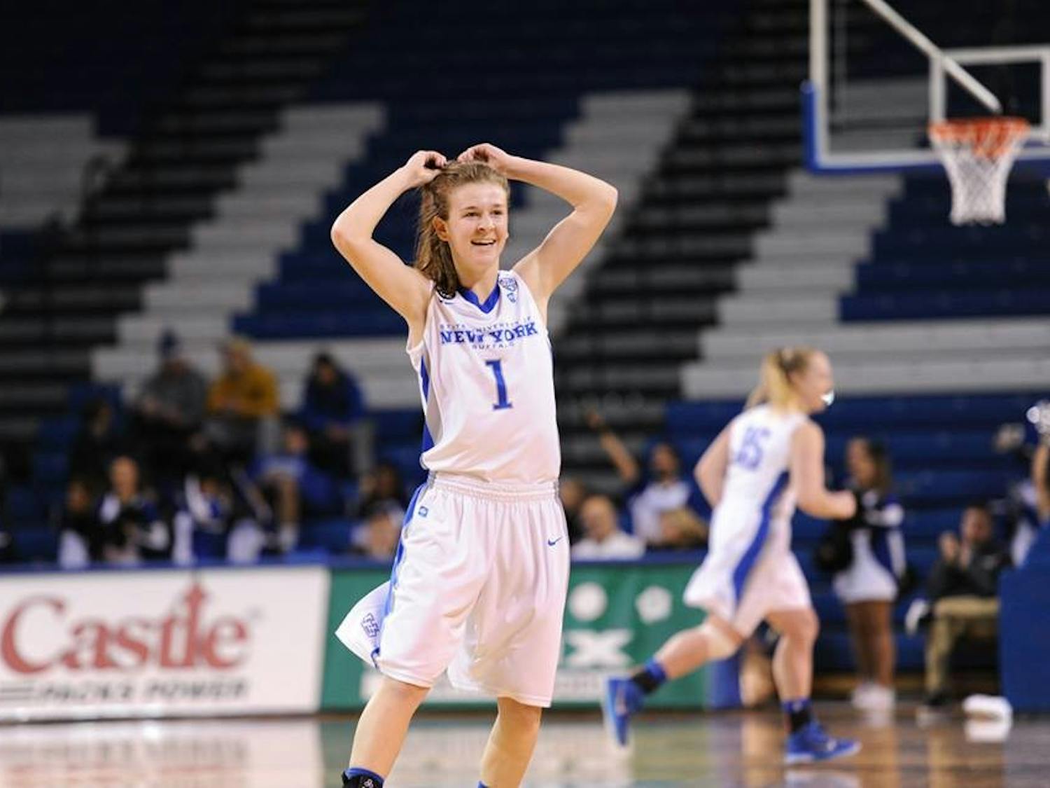 Sophomore guard Stephanie Reid celebrates in a game against Akron last season in Alumni Arena. Reid and the Bulls defeated Massachusetts 56-48 on the road Saturday to start 3-0 for the first time since the 2000-01 season. 