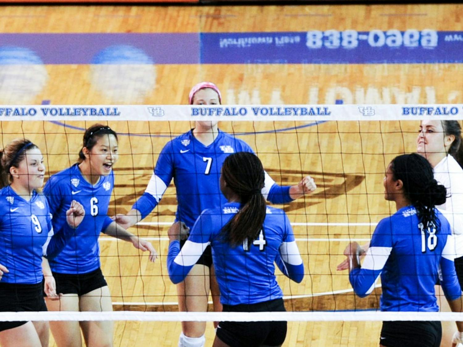 Marissa Prinzbach, Megan Lin, Megan Lipski and Cassie Shado share the court during a game. The Bulls will continue its season on Saturday and will play its first home match on Sept. 24.