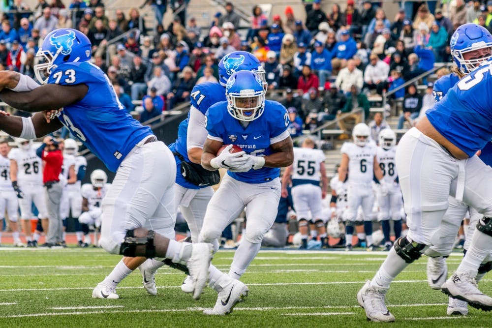<p>Freshman running back Jaret Patterson cuts inside through the hole. Patterson had a team-high 91 yards and a touchdown against the Akron Zips on Saturday.</p>
