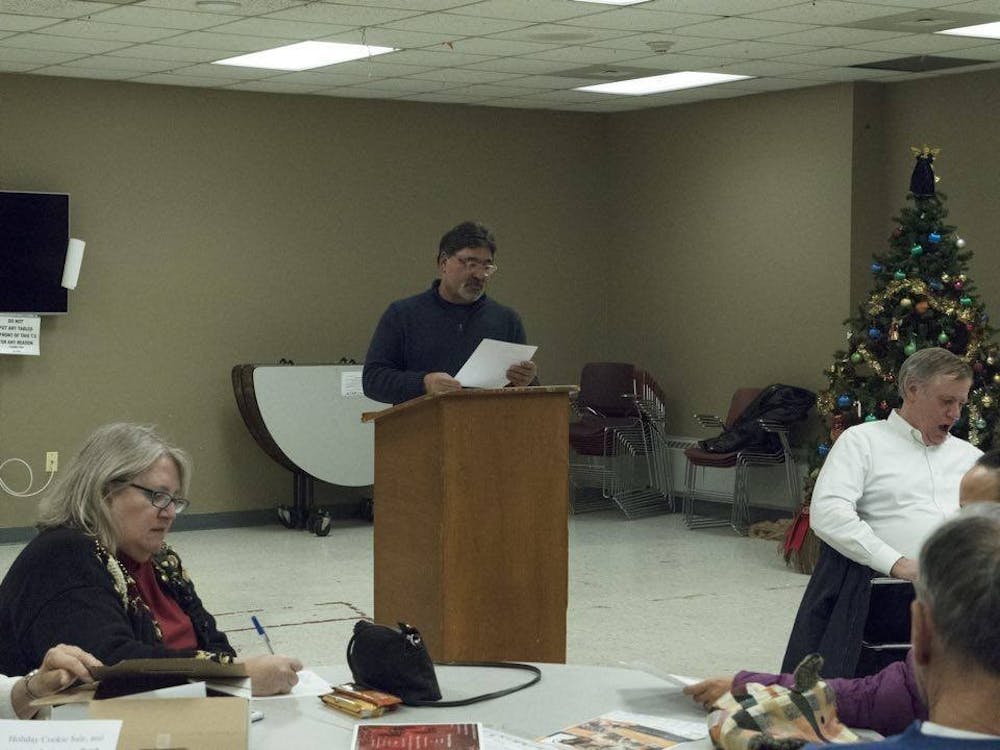 <p>Mickey Vertino, University Heights Collaborative president, speaks at&nbsp;the group's meeting in the Gloria J. Parks Community Center Tuesday night. The collaborative discussed the new student housing complex Axis 360, as well as parking and bar closing times.&nbsp;</p>