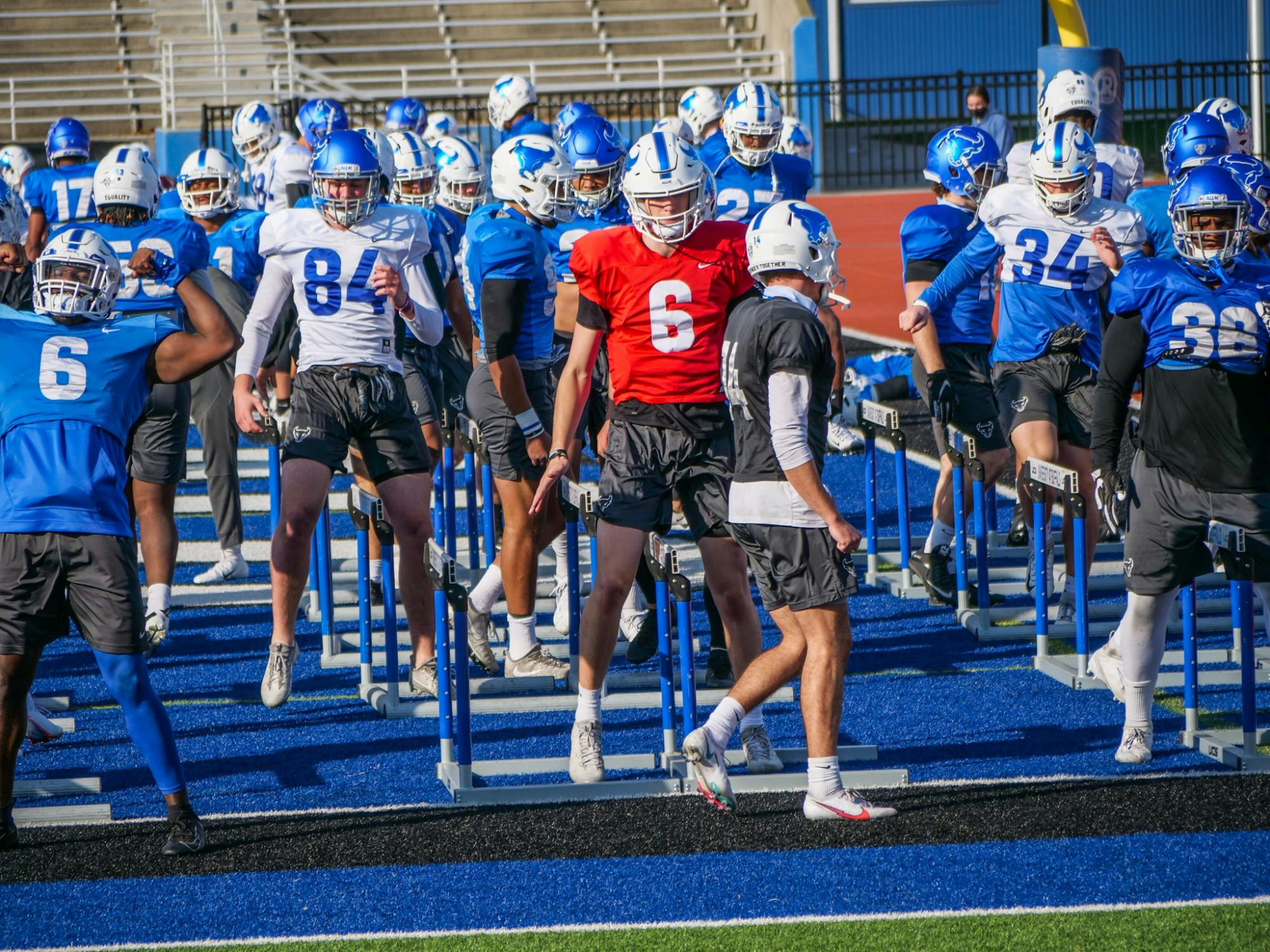 UB football held its first spring practice Monday. Quarterback Casey Case (6) and tight end Jackson Westfall (84) look to make an impact for the Bulls this season.