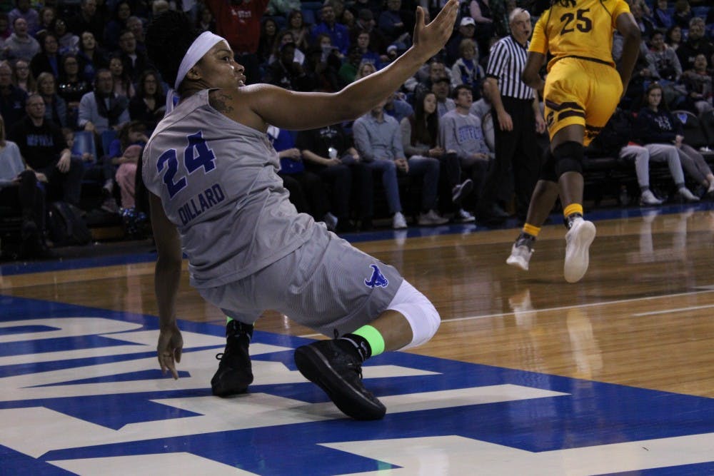 <p>Senior guard Cierra Dillard looks for the foul after a layup. Dillard finished with 29 points and seven steals despite temporarily leaving the game after getting elbowed in the face.</p>