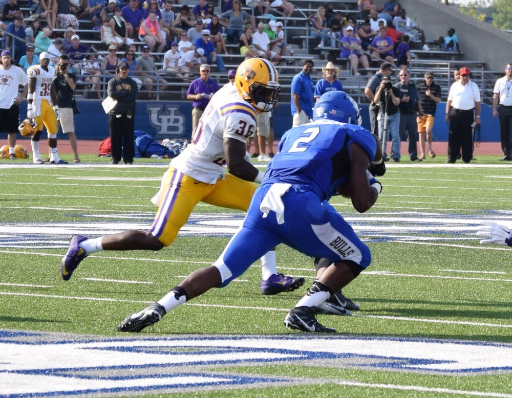 Jordan Johnson scrambles for a gain during Buffalo's opening day victory over Albany this past season. Johnson is expected to take over the starting running back position this upcoming season.&nbsp;