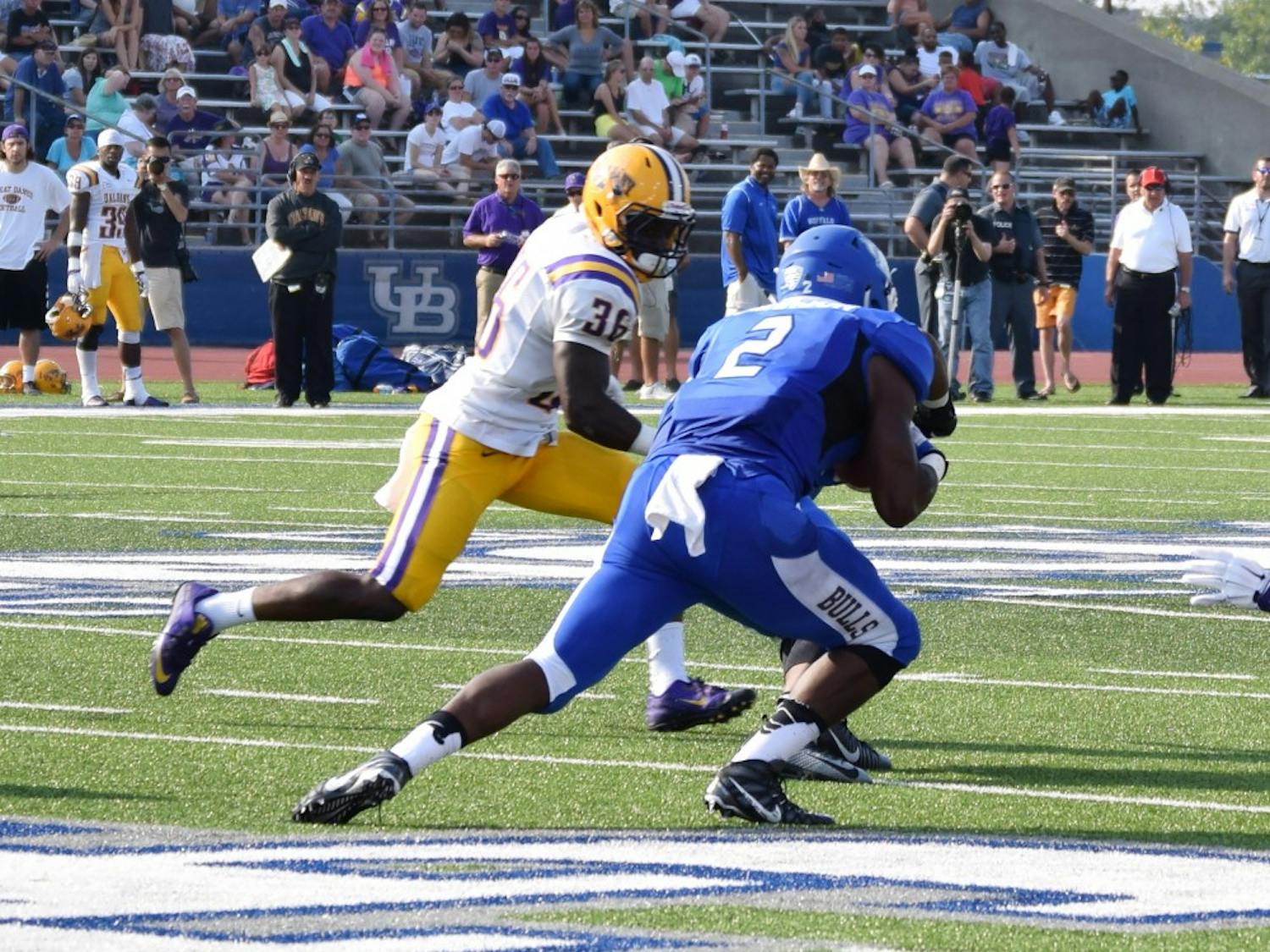 Jordan Johnson scrambles for a gain during Buffalo's opening day victory over Albany this past season. Johnson is expected to take over the starting running back position this upcoming season.&nbsp;