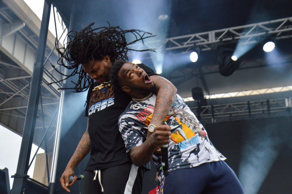 <p>Rapper Waka Flocka Flame (left) put on the most audience-involved performance of the night. Flocka and his hype man bounced around the stage, showering fans with champagne and water.</p>