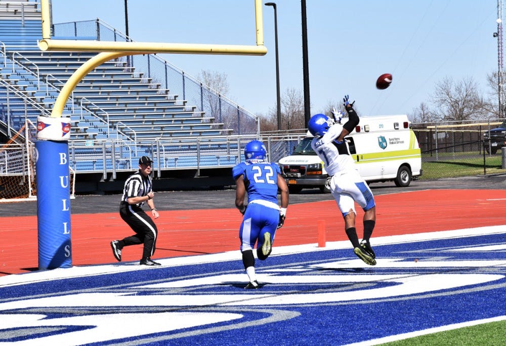 <p>Senior wide receiver Marcus McGill makes a touchdown catch in last Saturday’s Blue-White Spring game. Head coach Lance Leipold called McGill an “incredible player.”</p>
