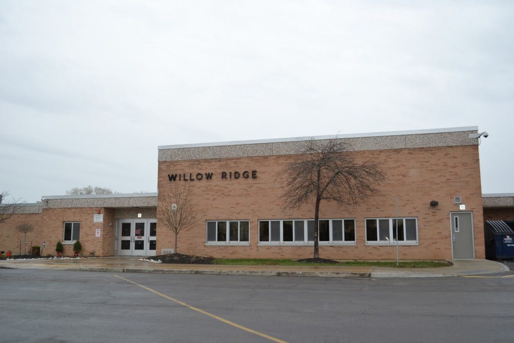 McKnight grew up on Vine Lane, off Sweet Home Road, and attended class at Willow Ridge Elementary School before his family moved in 1979.