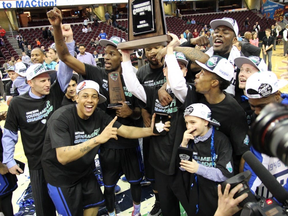 <p>The men's basketball team poses with its MAC Tournament Championship trophy after defeating Central Michigan in the title game on March 14 in Cleveland, Ohio. The MAC announced changes to the tournament on Thursday, including eliminating the triple-bye to the semifinal which Buffalo received last season. </p>