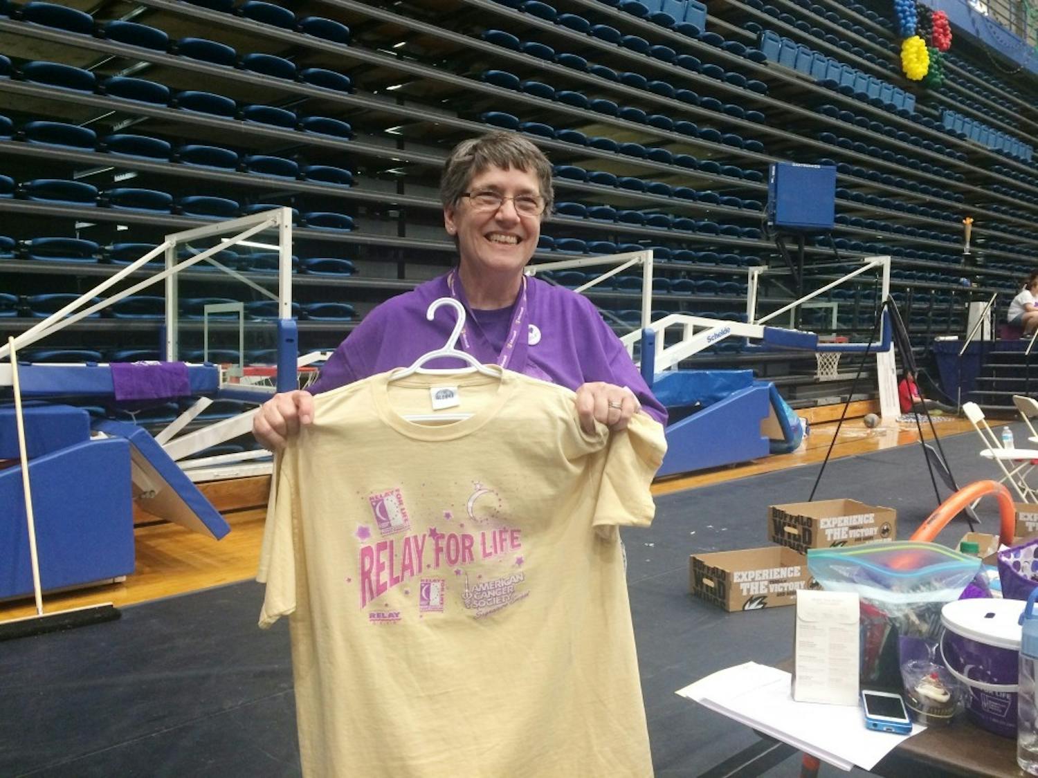 Survivor, teammate, committee member and honored guest Pricilla Snider displays the Relay for Life t-shirt from 1997.