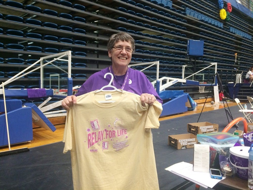 <p>Survivor, teammate, committee member and honored guest Pricilla Snider displays the Relay for Life t-shirt from 1997.</p>