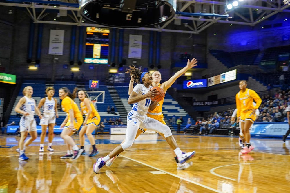 <p>Senior Guard Theresa Onwuka goes in for a shot during the game against Kent State in the Alumni Arena on Saturday.</p>
