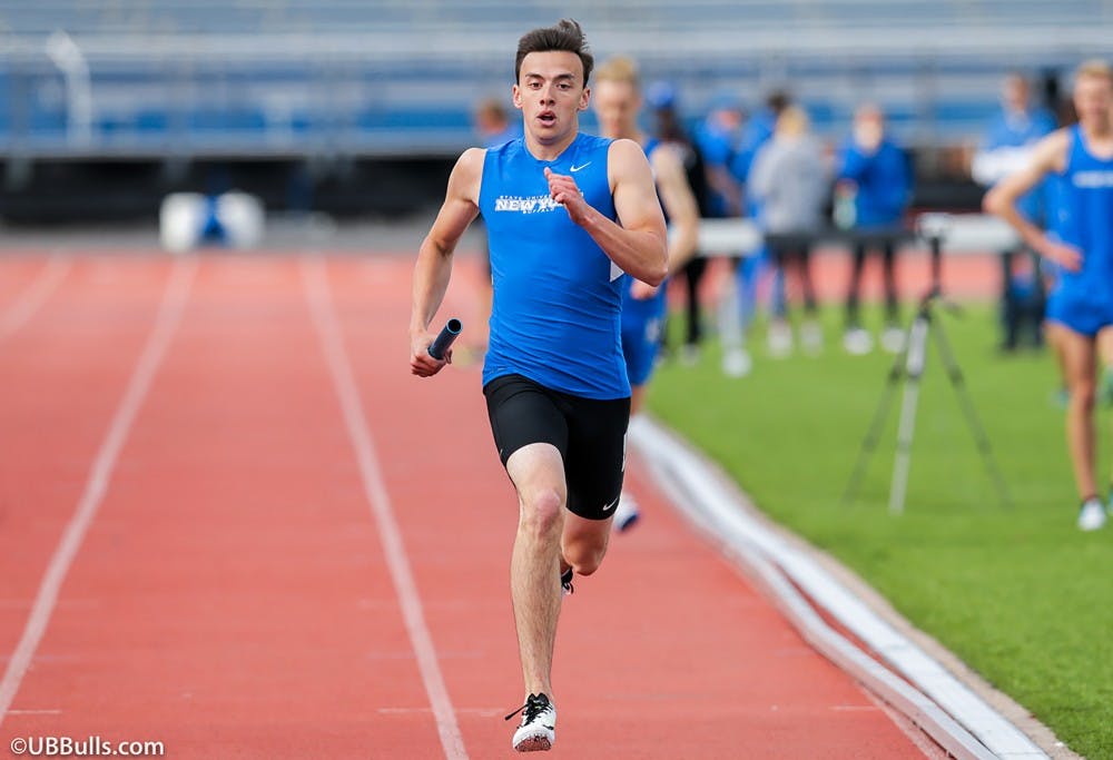 <p>Senior Mitchell Moore runs down the track. Moore was part of the Bulls 4x400 relay at the indoor MAC championships.</p>