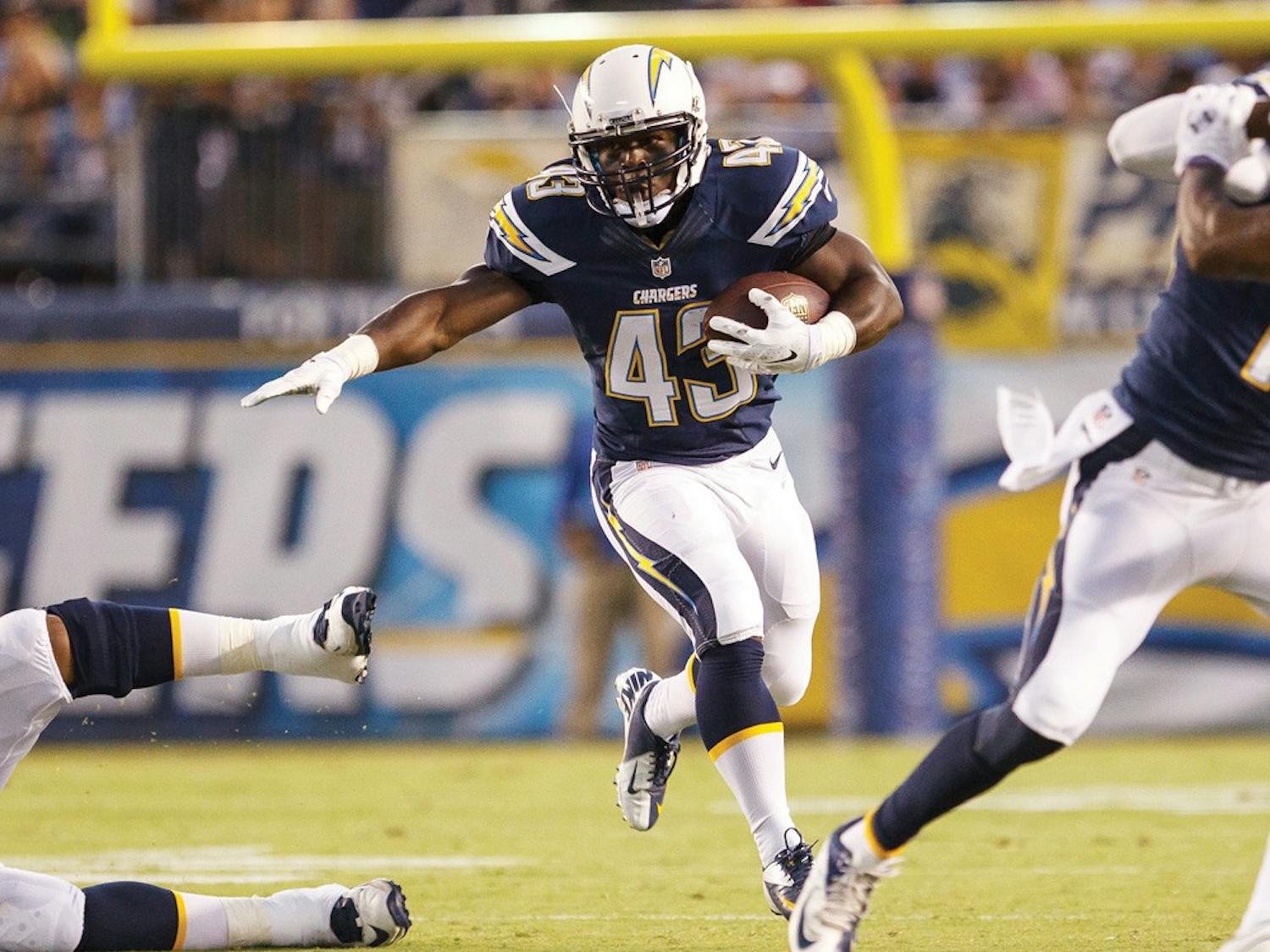 Branden Oliver runs the ball for a touchdown earlier this season for the San Diego Chargers. The former UB running back has been successful in the NFL.
