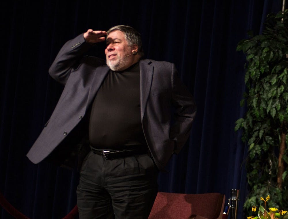 <p>Steve Wozniak salutes the Alumni Arena crowd Wednesday night after his Distinguished Speaker Series discussion. </p>