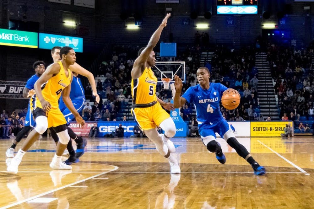 <p>Sophomore guard Davonta Jordan pushes to the hoop. The Bulls picked up their first win of the season the past Friday against the Canisius Golden Griffins.</p>