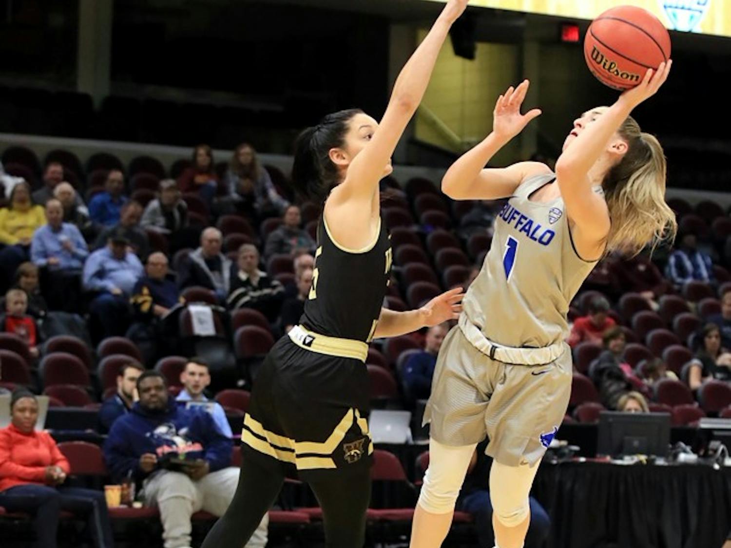 Senior guard Stephanie Reid looks for the layup in the crowded paint. The Bulls made program history Monday securing the team's first appearance in the Sweet Sixteen of the NCAA Tournament. 