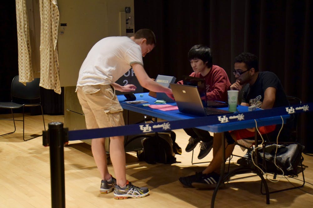 <p>Students sign up to vote in the SA elections in the Student Union theater on Tuesday. Students will have less choices than usual this year, as the Unity Party is running unopposed and SUNY delegates will no longer be elected.</p>