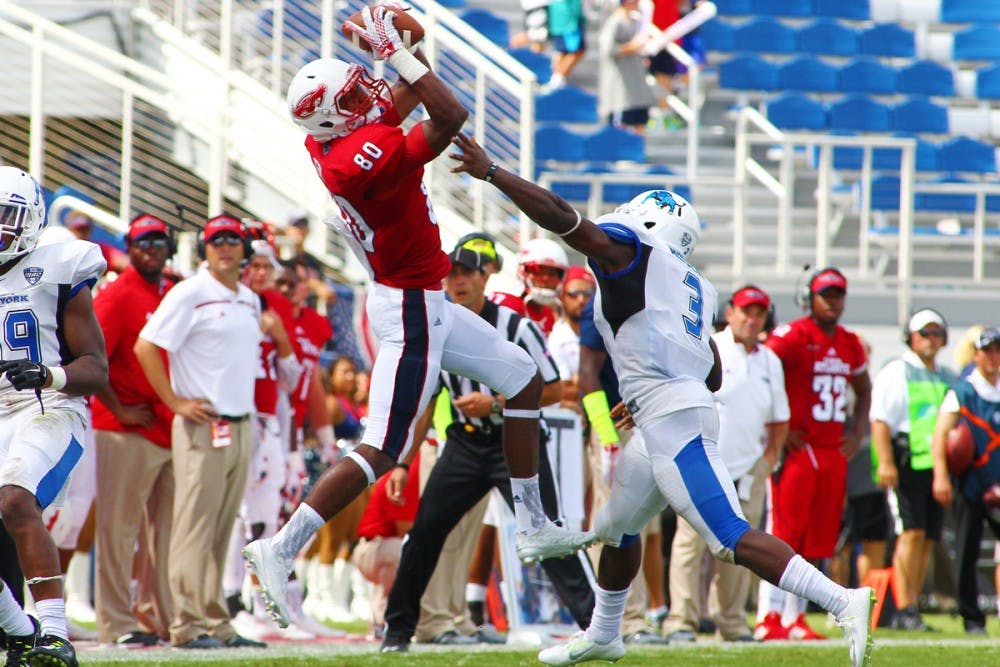 <p>Bulls linebacker Okezie Alozie attempts to break up a pass in coverage. The Bulls forced three turnovers and scored 23 points on defense in a victory over FAU on Saturday.</p>