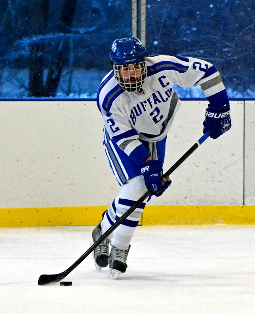 <p>Defenseman Sean Dungan glides through the ice with the puck secured by the stick. The UB hockey team got off to a fast start this season, holding a 2-0 record so far.</p>