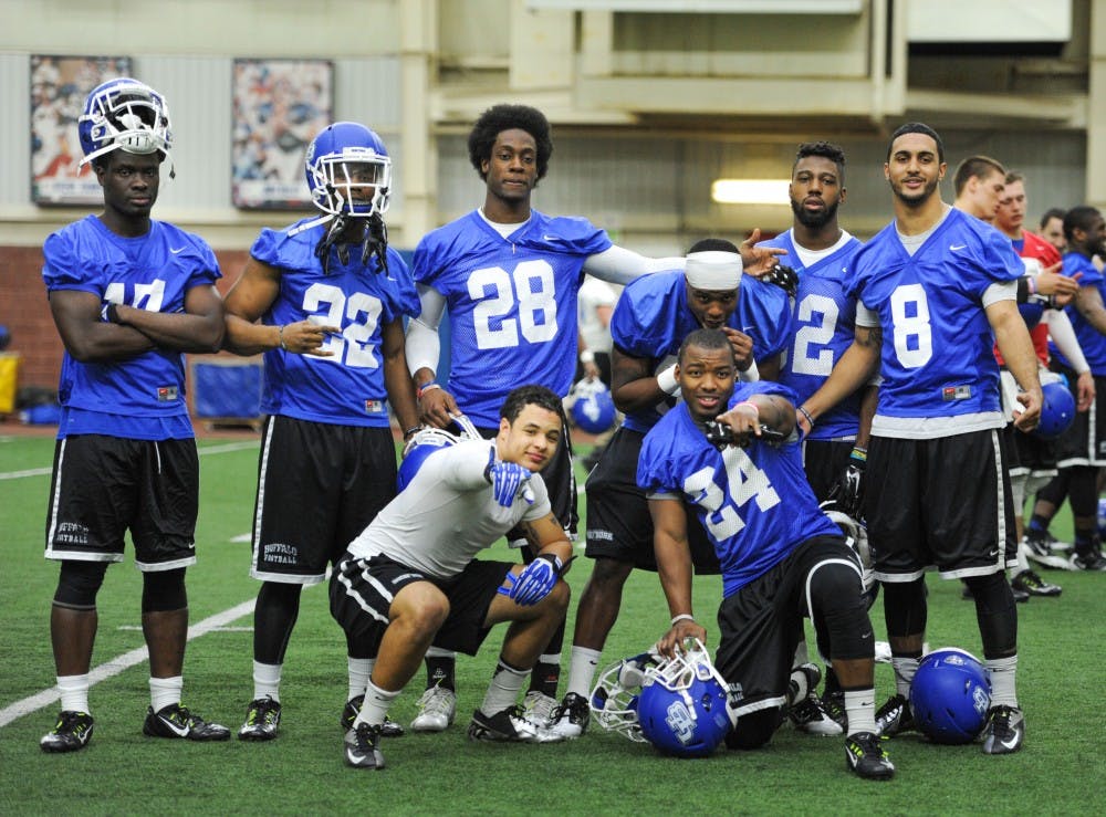 <p>The Bulls' defense poses in a spring practice at the Buffalo Bills Field House. The Bulls' defense will be going through a makeover this season. </p>