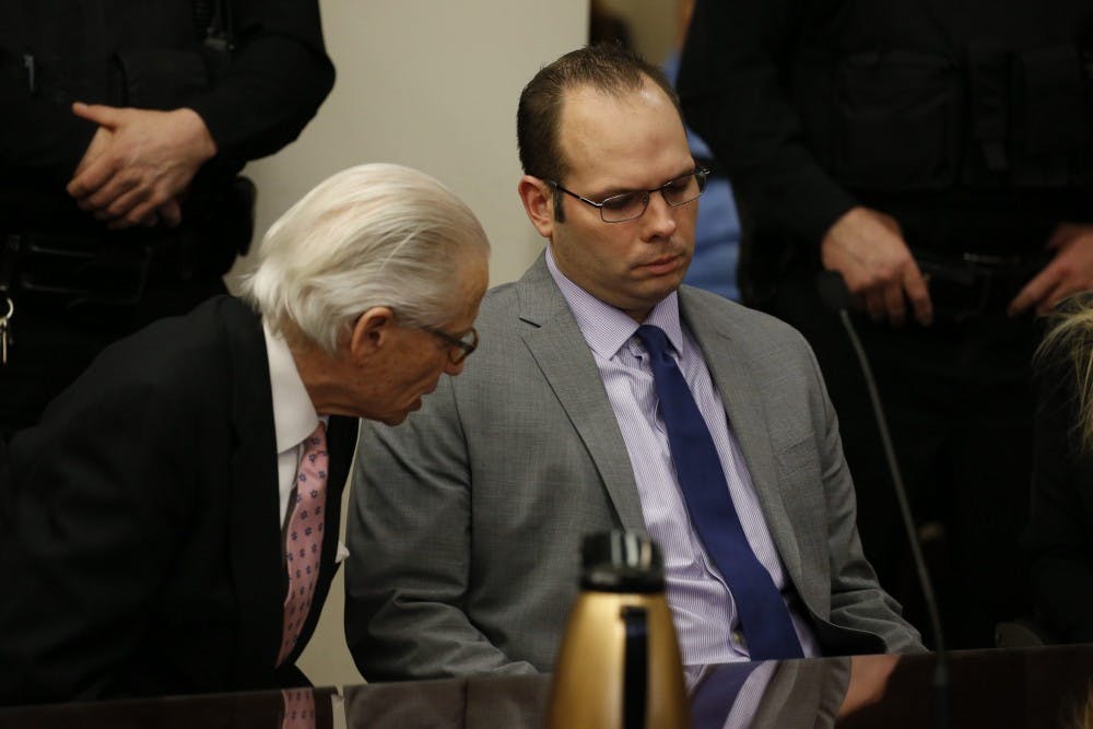 Jeffrey Basil, right, and his defense attorney Joel Daniels, left, react after Basil was found guilty of 2nd degree murder  and tampering with evidence on Wednesday, Jan. 21, 2015, by a jury presided over by Justice Penny M. Wolfgang in Erie County Court.  (John Hickey/Buffalo News, pool)