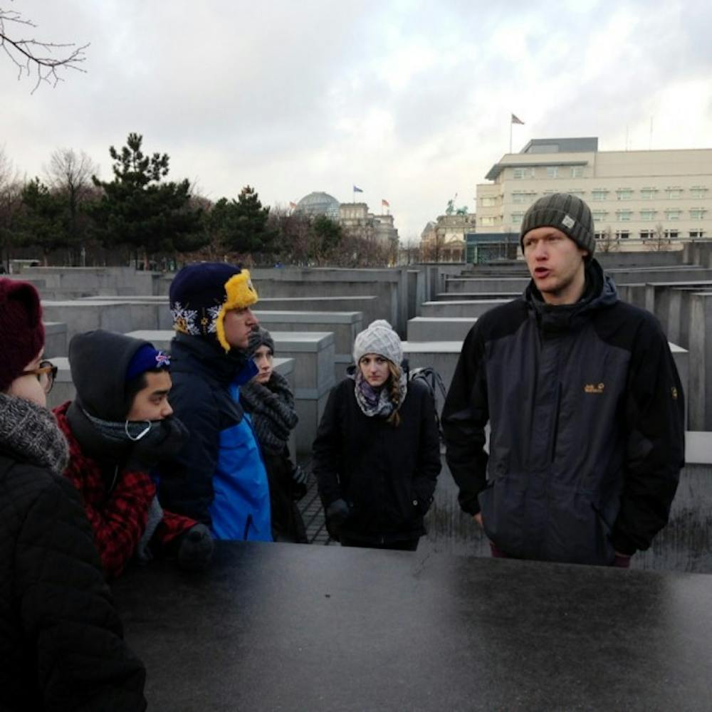 Neil Cameron, a tour guide in Berlin,
appreciates the history and contradictions of the city
which has been&nbsp;reinvented six times in 140 years.
Here, he leads the University at Buffalo Foreign Reporting in Berlin
study abroad group&nbsp;on a tour of the Memorial to the Murdered Jews of Europe.
Courtesy of Jody Biehl