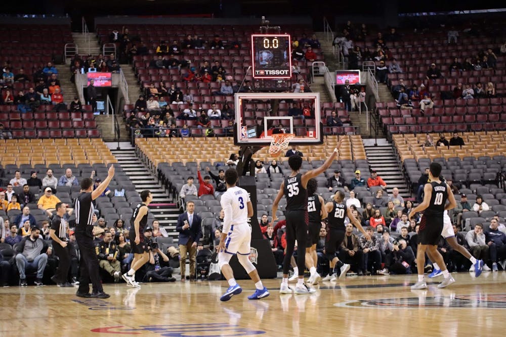 Junior guard Jayvon Graves watches as his shot beats the first-half buzzer against Harvard Saturday.