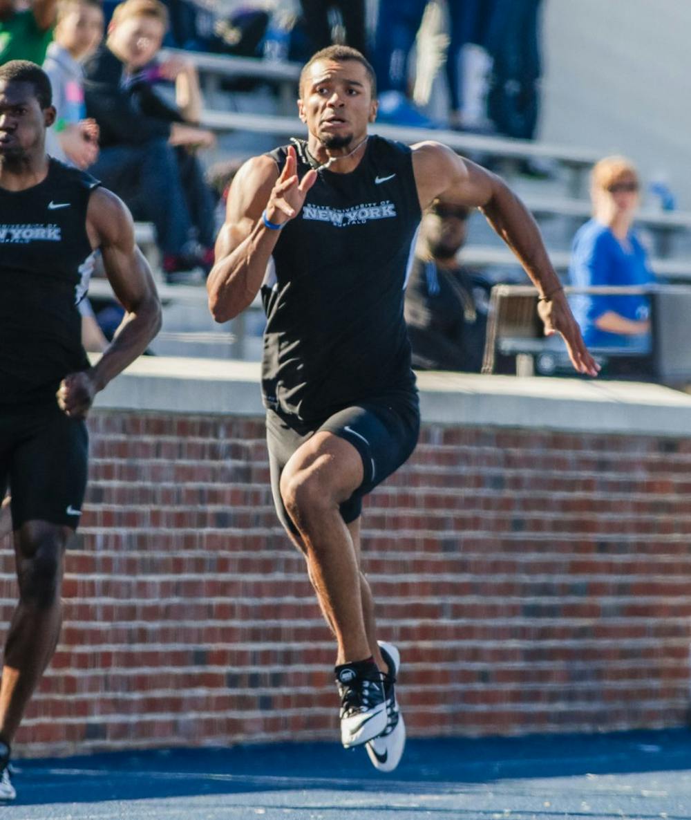 <p>Senior Ryan Billian warms up before a meet. Billian has broken several records in his UB career and is hoping to make a run at the 2020 Olympics.</p>