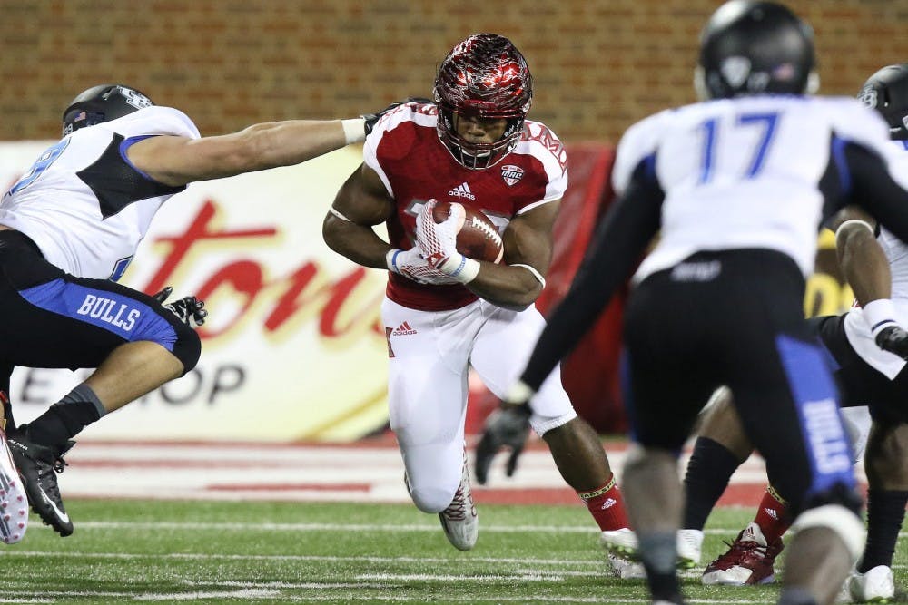 <p>Miami Ohio freshman running back Leonard Ross runs with the ball during Buffalo’s 29-24 win Thursday night. Buffalo is now 4-4 and 2-2 in the Mid-American Conference. </p>