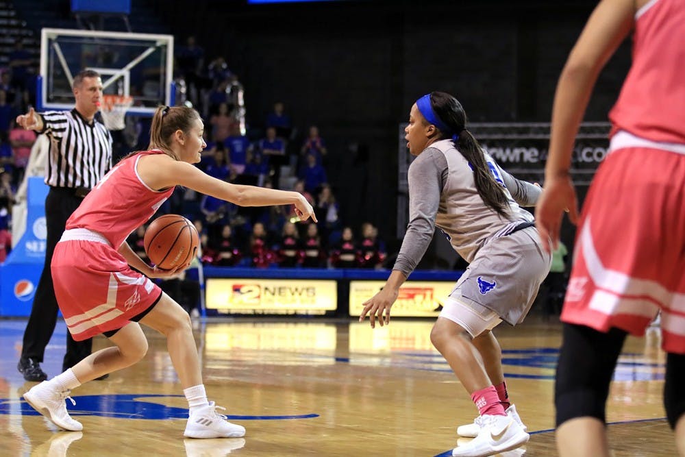 <p>Junior guard Cierra Dillard defends against a shooter. Dillard had 10 points and 7 assist against Bowling Green Wednesday.&nbsp;</p>