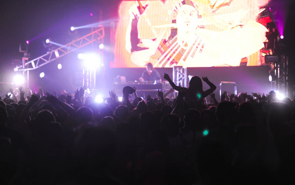 <p>UB students dance during last year's Electric Tundra in Alumni Arena, an electronic music and dance-themed concert.&nbsp;</p>