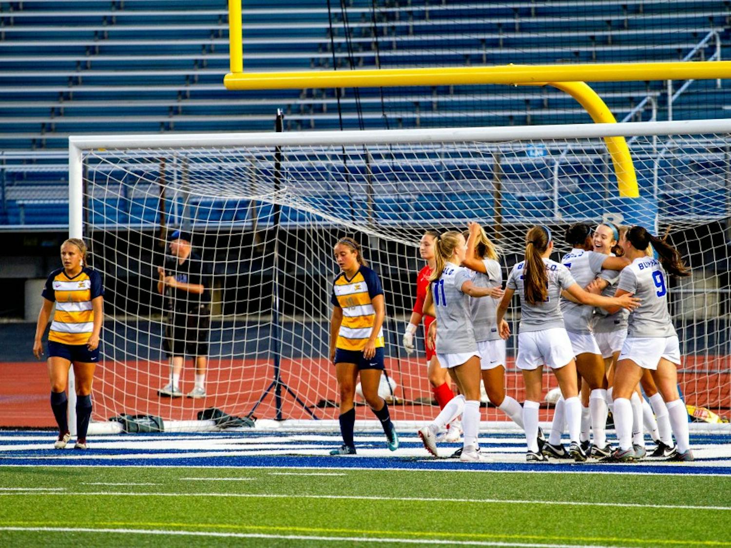 The Bulls celebrate at the net after scoring at UB Stadium. Soccer went 1-1 this past weekend but players said they are confident they will go 2-0 with games Friday and Sunday at home.