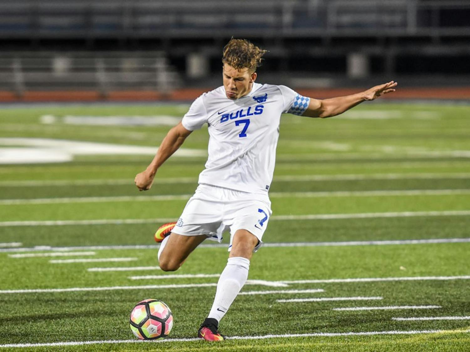 Senior forward&nbsp;Russell Cicerone strikes a free kick at UB Stadium on Sept. 21. His goal and assist helped the men’s soccer team defeat St. Bonaventure 2-1.