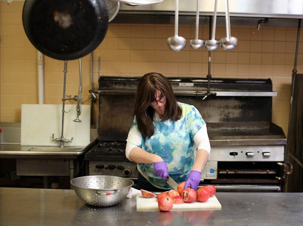 <p>Rivka Gurary, wife of Rabbi Moshe Gurary of The Chabad House of Buffalo, prepares Rosh Hashanah dinner for over 300 expected guests. Rivka and her husband will also be preparing food for some of UB’s Jewish population to come and celebrate the eight-day Jewish holiday of Passover.</p>