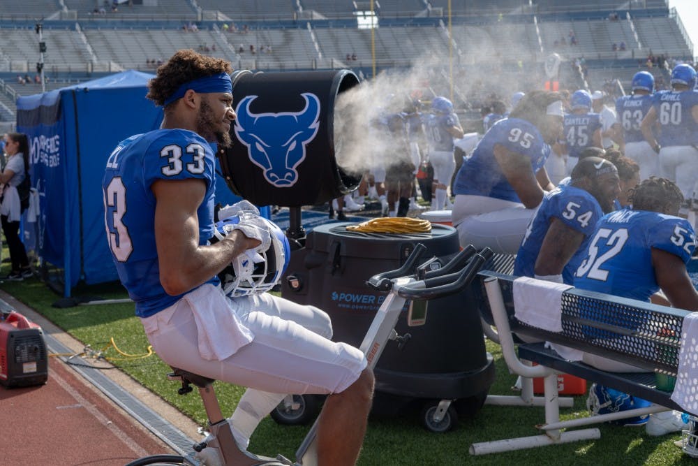 Tyrone Hill warms up on the exercise bike.
