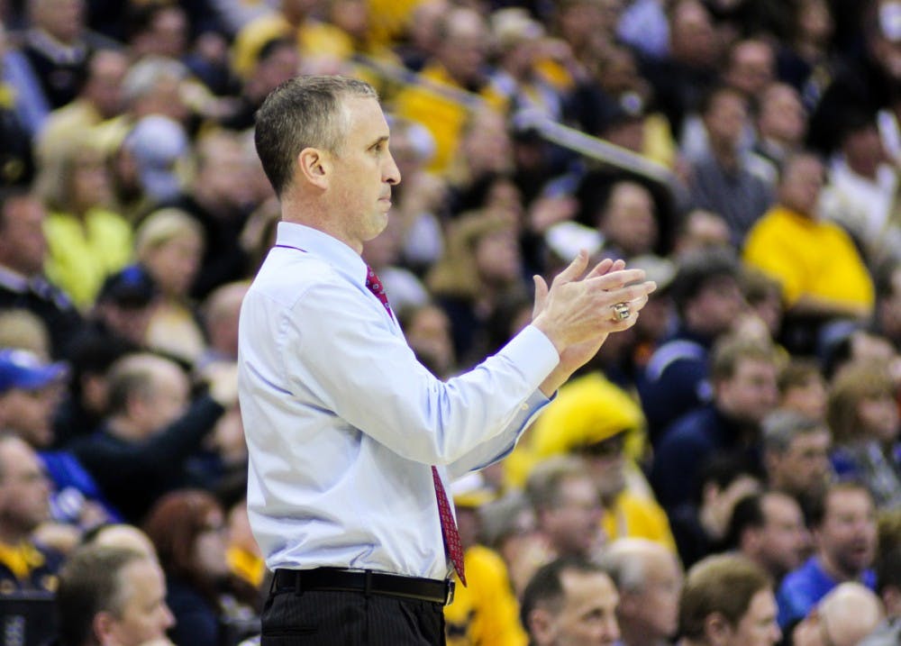 <p>Bobby Hurley coaches during the Bulls' 68-62 loss to West Virginia at NCAA Tournament held at the Nationwide Arena in Columbus, Ohio.</p>