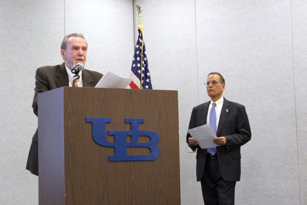 <p>Robert Shibley speaks from podium with President Tripathi beside him.&nbsp;The UB Faculty Senate voted against a resolution Tuesday afternoon&nbsp;to censure Dean of the School of Architecture and Planning Robert Shibley, with 43 opposed, 15 in favor and three abstaining.</p>