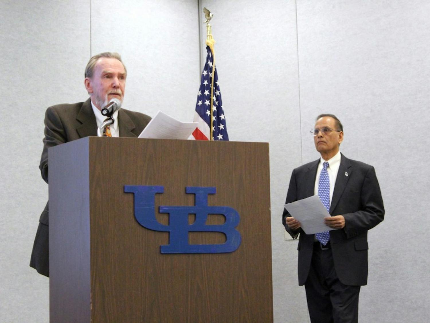 Robert Shibley speaks from podium with President Tripathi beside him.&nbsp;The UB Faculty Senate voted against a resolution Tuesday afternoon&nbsp;to censure Dean of the School of Architecture and Planning Robert Shibley, with 43 opposed, 15 in favor and three abstaining.