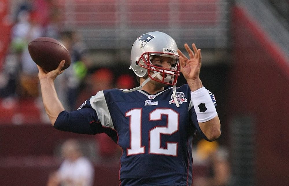 <p>Tom Brady throws the ball. The Patriots are the favorite to win the AFC this year.</p>