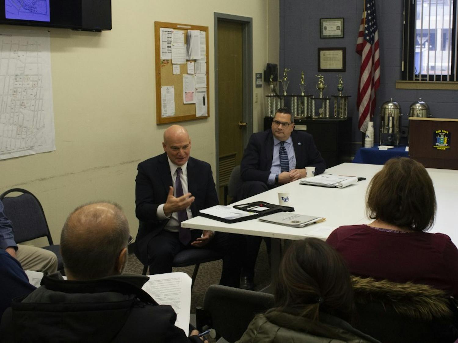 Chris Bartolomei, interim chief of police (left) and Mark Coldren, chair of the chief of police search committee (right) talk during a community forum Wednesday. Bartolomei is one of three candidates being considered for the position. The other two candidates will speak at forums on Thursday and Friday. 
