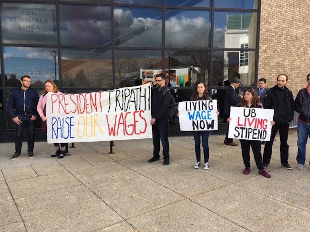 <p>Demonstrators staged a protest outside of Slee Hall Thursday afternoon demanding "living stipends." The protest took place outside of the Celebration of Academic Excellence ceremony.&nbsp;</p>