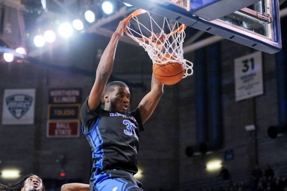 In two games played last week, the men&rsquo;s basketball team went 2-0, including a dominant win over first-place Kent State on Friday. Here Raheem Johnson dunks the ball during Friday night&#39;s game. The Bulls shot 46 percent from the field, while forcing 22 steals and 32 turnovers. Yusong Shi, The Spectrum
