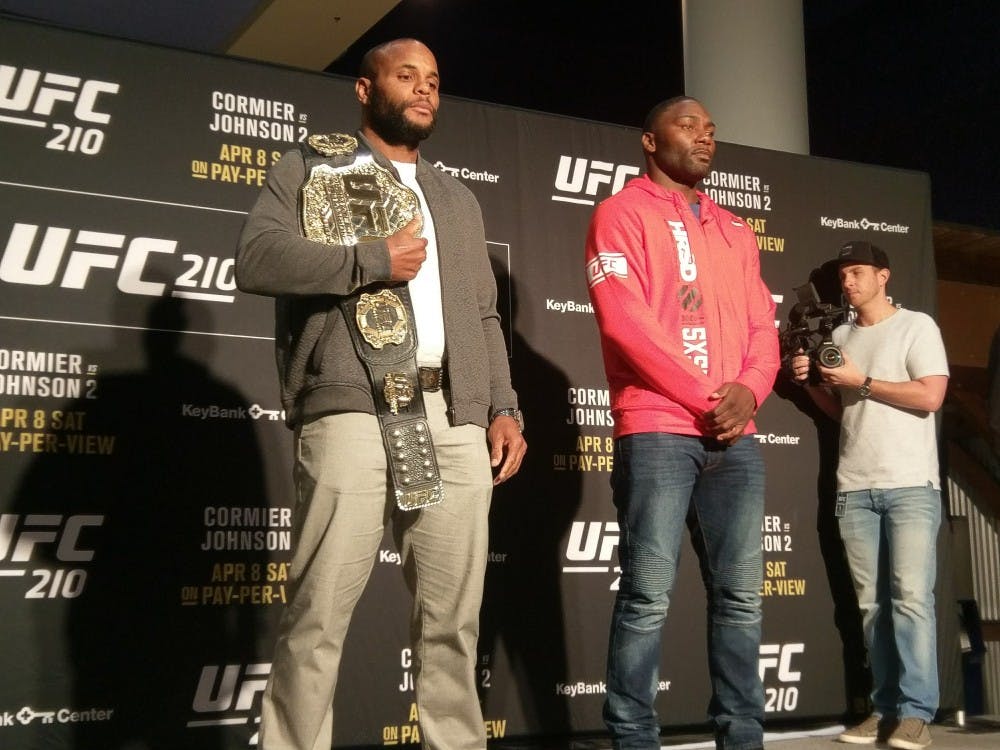 <p>UFC light heavyweight champion Daniel Cormier (left) poses next to UFC fighter Anthony Johnson (right). The two are set to fight in the main event of UFC 210 this Saturday.</p>