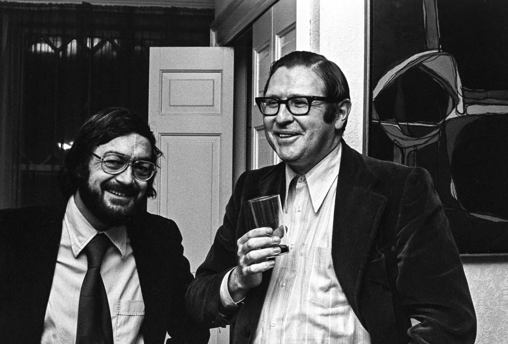 <p>O’Grady (right) at a party in 1974 with Provost of Arts and Letters, John Sullivan (left). O’Grady, who died on Tuesday, leaves a lasting legacy as the founder of the media study department at UB.</p>