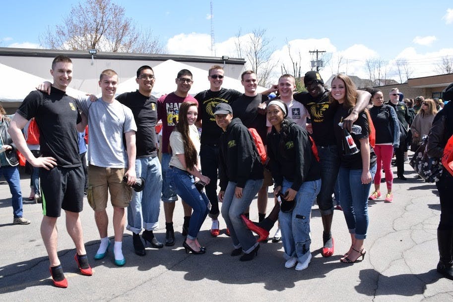 Members of the ROTC club showed their support for Walk a Mile in Her Shoes by donning heels and walking about a mile around downtown Buffalo.