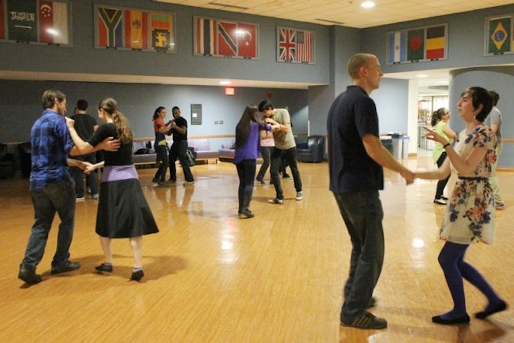Eileen Bennett (far right), a sophomore mathematics major, and Chad Vincton, who recently graduated with a Bachelor&rsquo;s in political science, danced together during a weekly meeting of UB&rsquo;s Swing Dance Club.&nbsp;Priscilla Kabilamany, The Spectrum