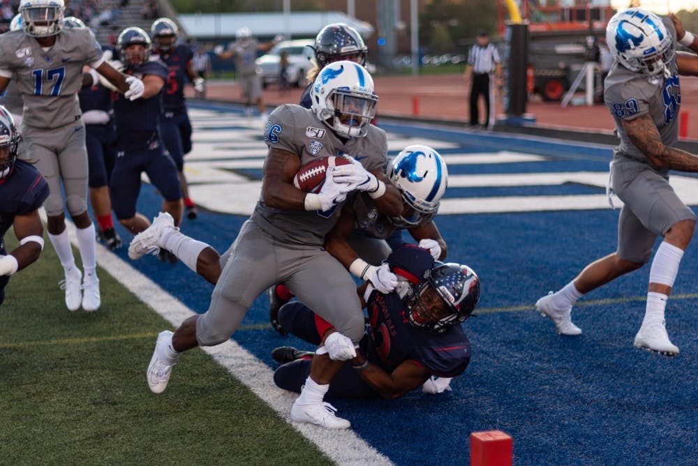 <p>UB running back Jaret Patterson takes one to the end zone last season as the Bulls defeated Robert Morris 38-10.</p>