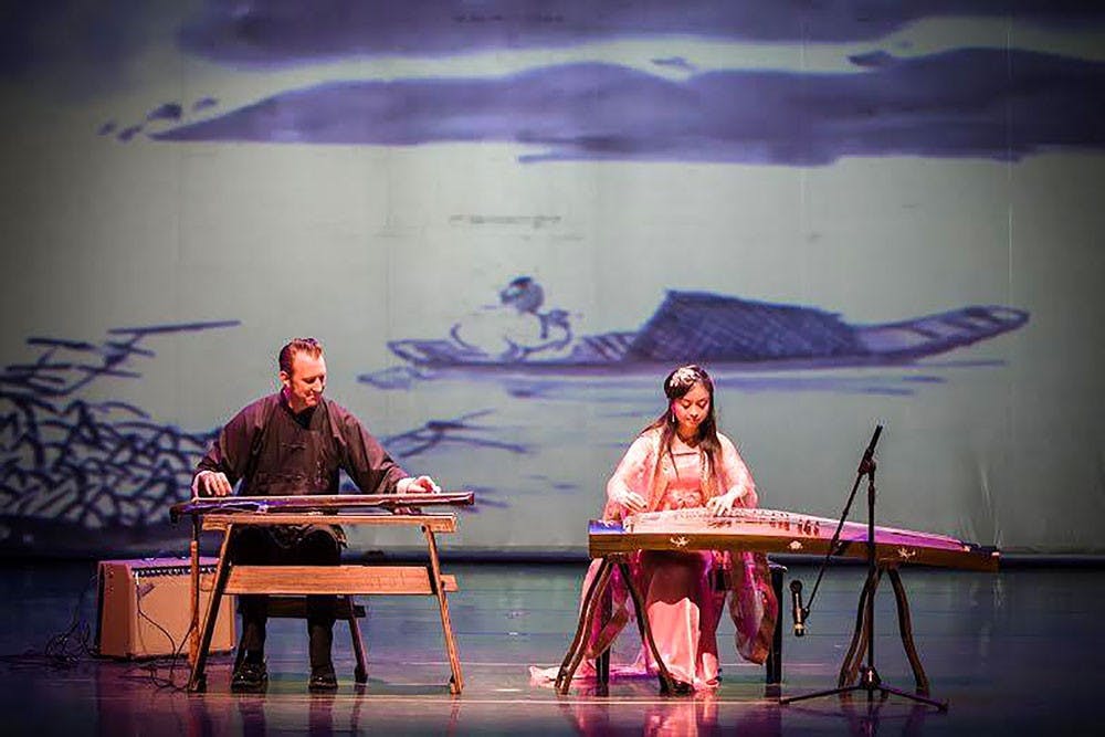 <p>Peter Worden (left)&nbsp;and Daisy Wu (right)&nbsp;perform a song for the Chinese New Year Celebration. For the fifth year in a row, the UB Confucius Institute is holding a performance in Center for the Arts to teach students about Chinese New Year culture and traditions .</p>